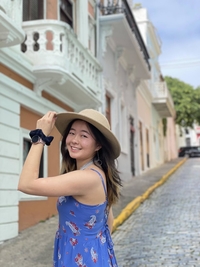 Angel smiling with a sun hat in Puerto Rico.